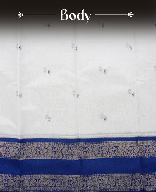 Off White Colour Semi Silk Saree Featuring Navy thread buttas On Body, Highlighted by contrast border with circle motifs, paired with matching blouse piece.