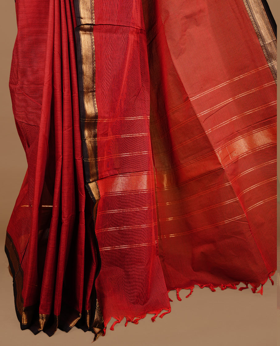 Dark red colour chettinad cotton saree featuring Plain body, complemented by Chocolate with zari border, paired with matching blouse piece.
