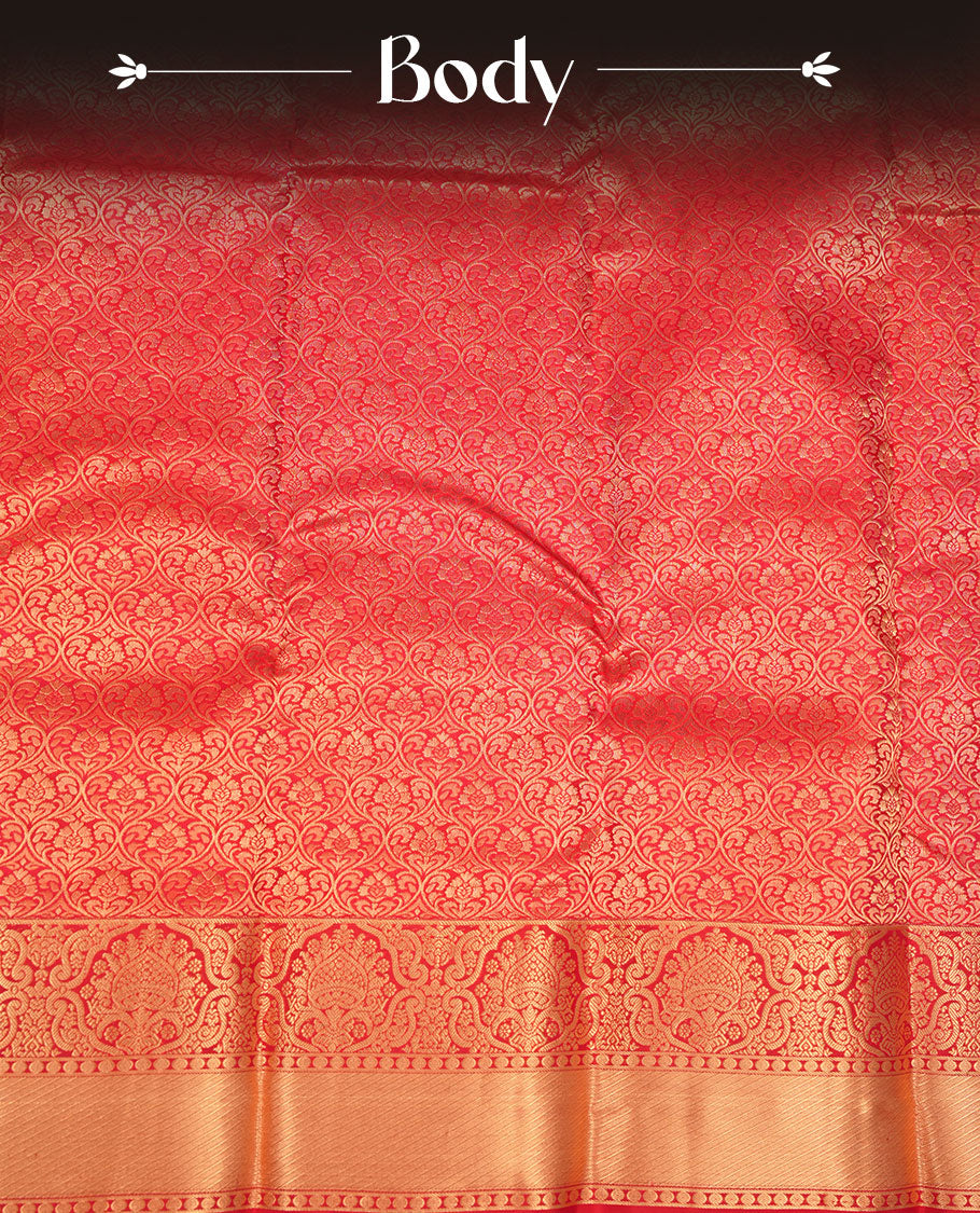 Cherry red colour kancheepuram silk saree featuring floral zari jacquard on body with traditional zari border, paired with matching blouse piece.