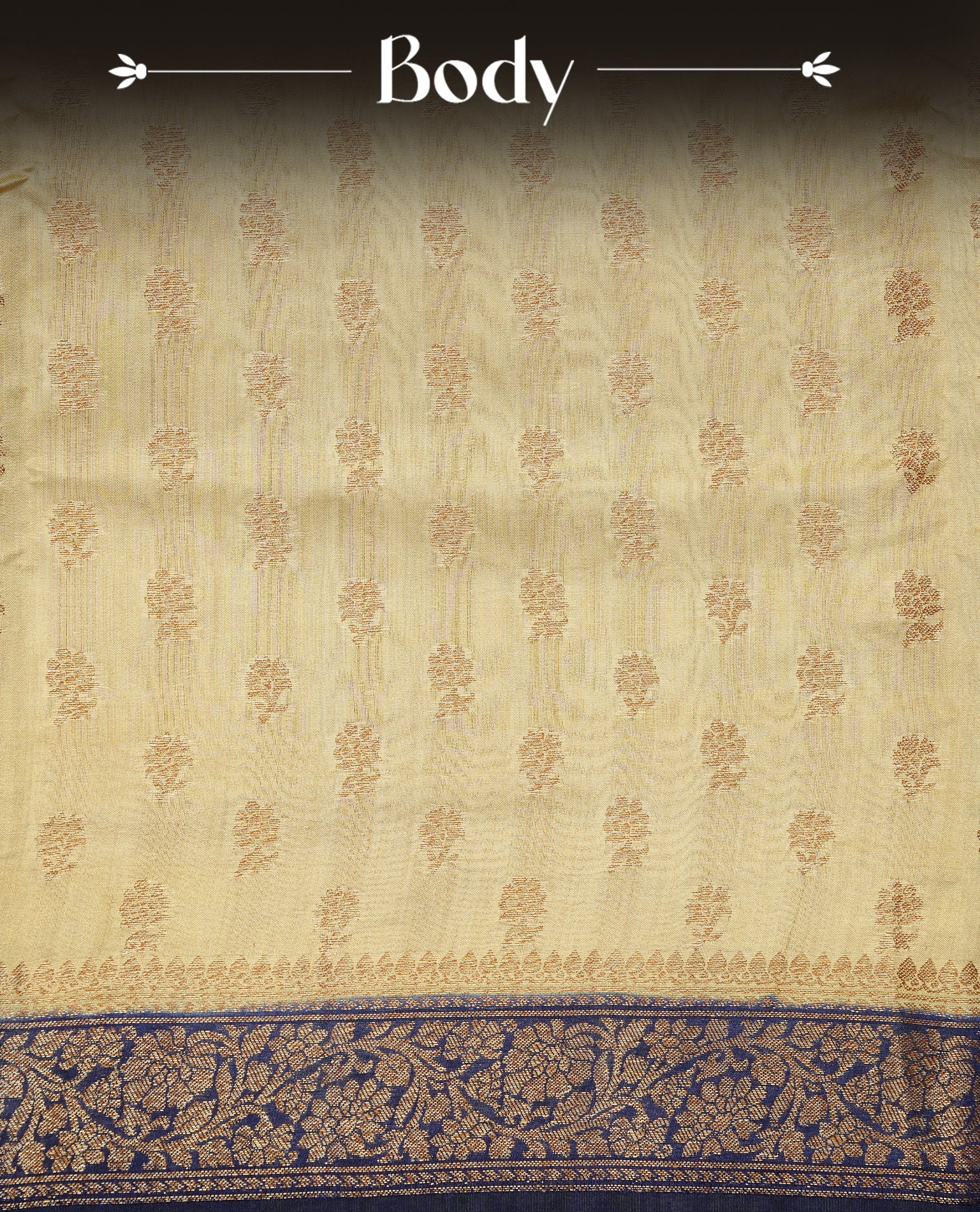 Cream colour Banaras tussar silk saree featuring elegant gold zari buttas across the body, complemented by a contrast Navy Blue border with rich zari detailing. Comes paired with a matching blouse piece.