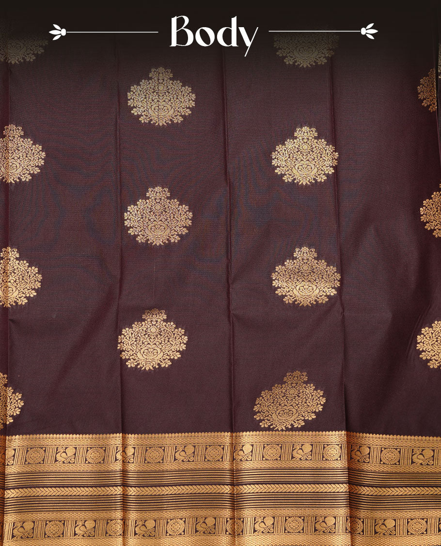 Dark chocolate colour soft silk saree featuring Gold zari motifs on body, complemented by self colour with traditional border, paired with matching blouse piece.