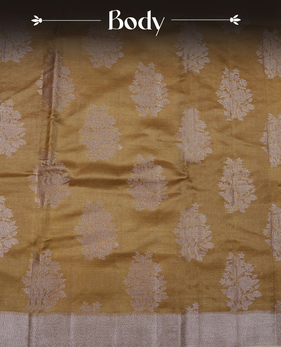 Olive colour pure banaras tusser silk saree highlighting antique zari pattern across body, with contrast cream colour with zari border and paired with matching blouse
