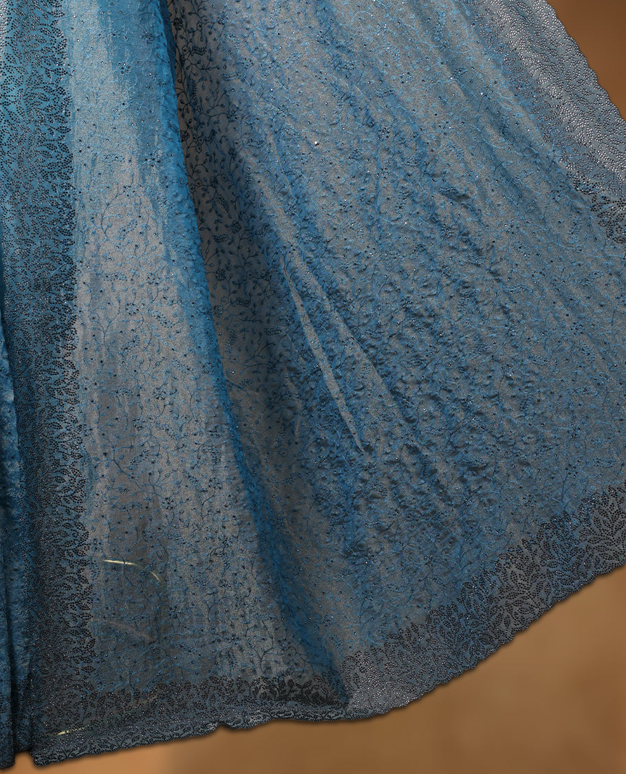 Light blue colour velvet chiffon designer saree, featuring self colour thread embroidery kodi work on body, stone work and all over motifs on border and  pallu, Paired with matching blouse.