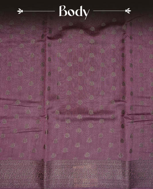 Dusted purple colour semi tussar silk saree featuring elegant Antique zari motifs across the body, designed with a subtle borderless zari finish for a sophisticated traditional look. Paired with a matching blouse piece.