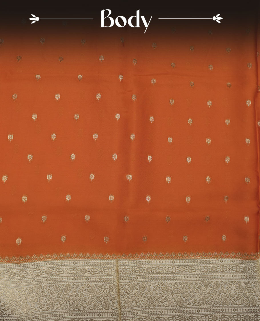 Orange colour banaras satin crepe saree featuring gold zari motifs on body, with contrast cream colour border with gold zari pattern and paired with matching blouse.