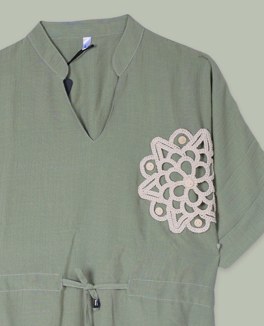 Olive green short-sleeve top with V-slit band neckline, contrast beige crochet motif on one side, and adjustable drawstring at the waist.