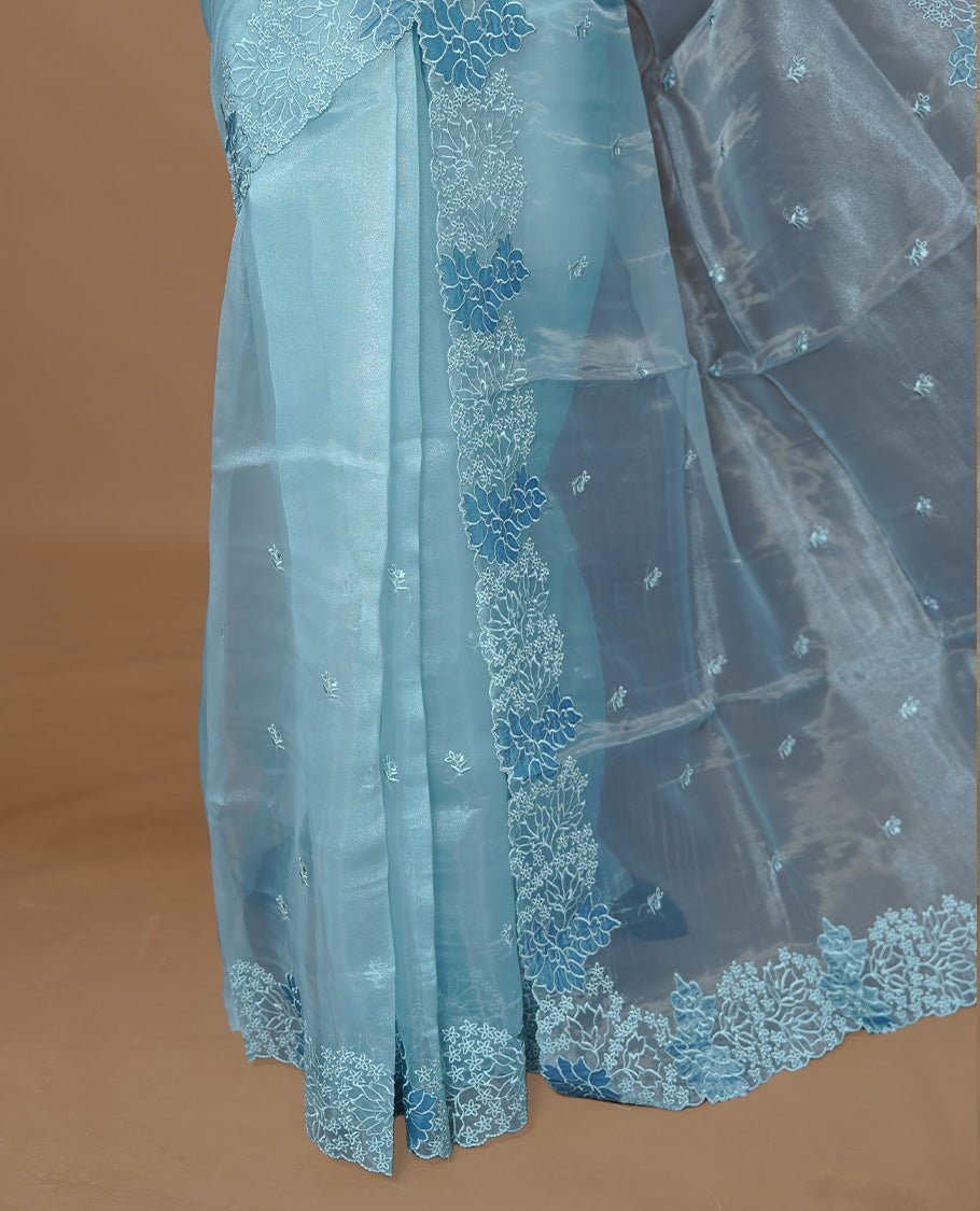 Pastel Blue colour Pure Organza Featuring Self colour Embroidery motifs on body, Enriching floral thread pattern & scalp border, paired with matching blouse piece.