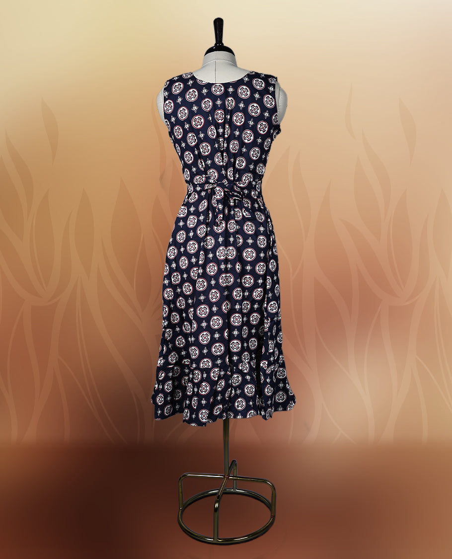 Black colour sleeveless nightwear with stylish white circular prints and a flattering V neckline, Tailored for comfort with a flared hem, perfect for casual outings, daily wear, or relaxed summer days.