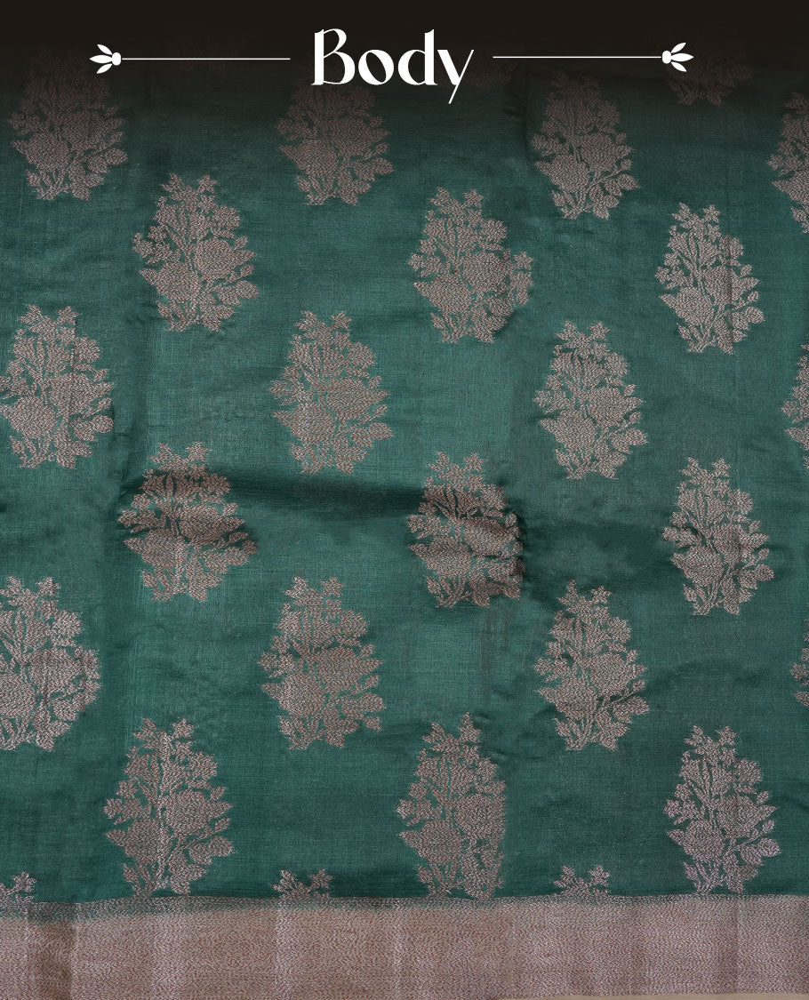 Green colour pure banaras tusser silk saree highlighting antique zari pattern across body, with contrast cream colour with zari border and paired with matching blouse