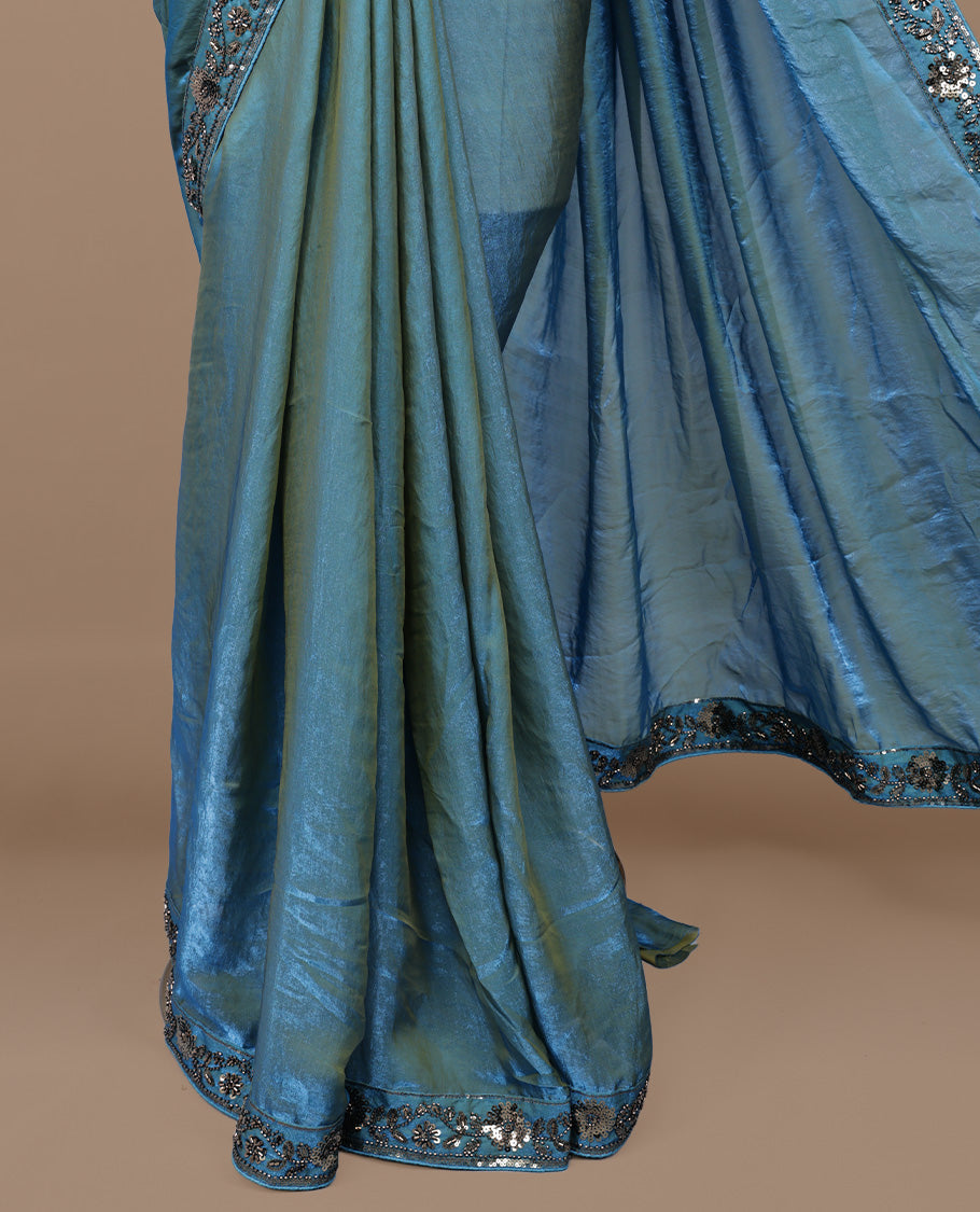 Gold & blue double shade designer saree features Elegant plain body, highlights Sequins & cut beats on border, paired with ready made blouse.