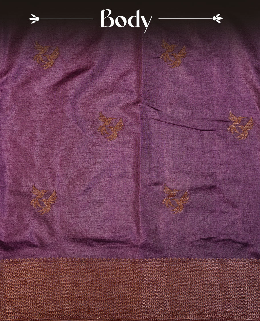 Purple colour semi banaras tussar silk saree highlighting gold zari bird motifs on body, complemented by self colour with antique zari border, paired with matching blouse piece.