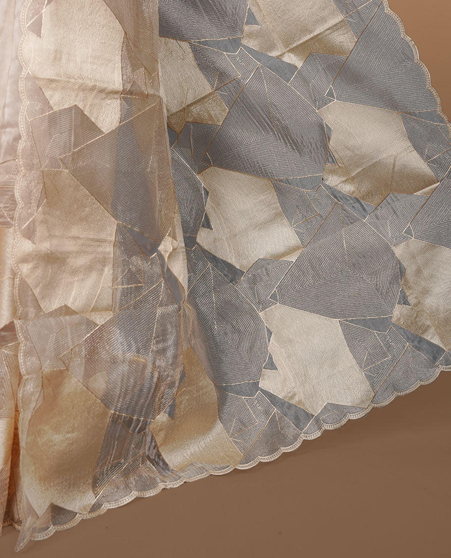 Beige colour Organza designer saree featuring a thread geometric pattern across the body, enhanced with a piping border and cut beats work on matching blouse piece.