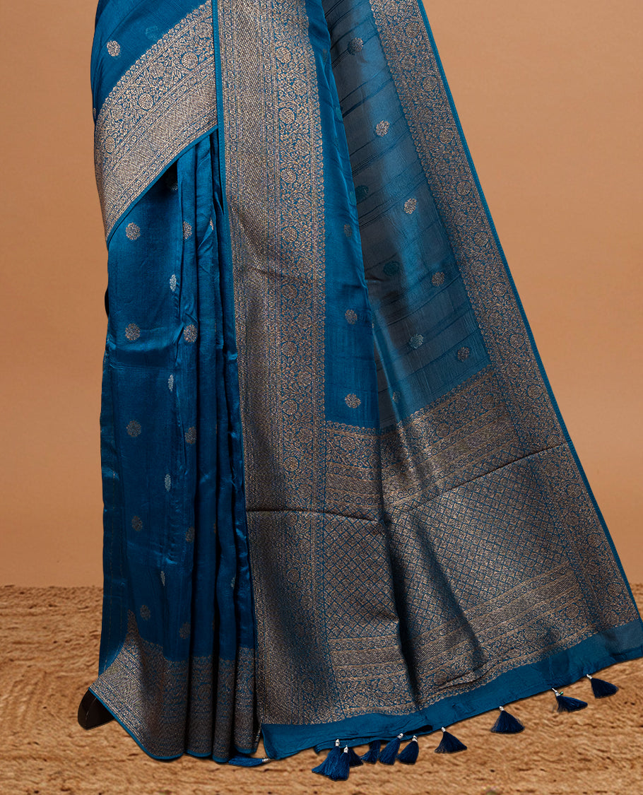 Light aqua colour Semi banaras tussar georgette Saree featuring Antique zari motifs on body, enhanced with antique zari border, paired with a matching blouse piece.