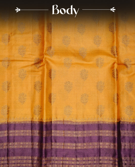 Mustard colour pure tussar banaras silk saree featuring gold zari motifs on body, highlighting contrast Purple colour with zari border, paired with matching blouse piece.