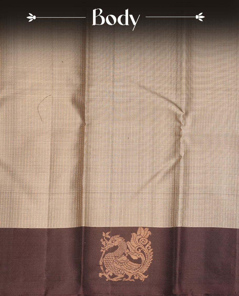 Grey colour soft silk saree featuring vertical lines on body, complemented by contrast burgundy brown with peacock buttas border.