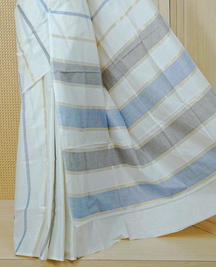 Off White Colour Cotton  Kerala Saree Featuring Light Gold & Grey , Blue Zari Stripped Body, Enrich By Zari Border, Pallu ,Comes With Matching Blouse Piece.