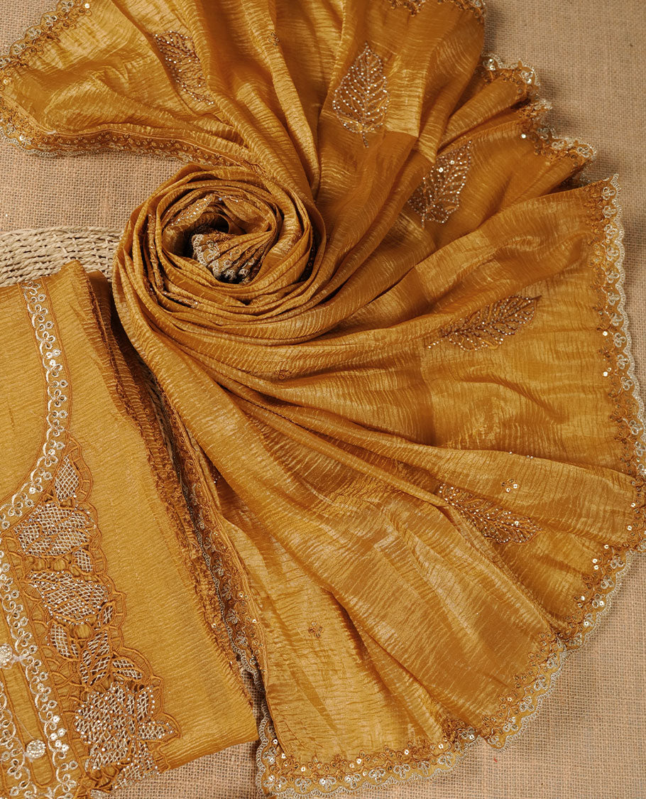 Mustard colour churidar set with stone and thread embroidery and detailing, paired with matching pant and dupatta.