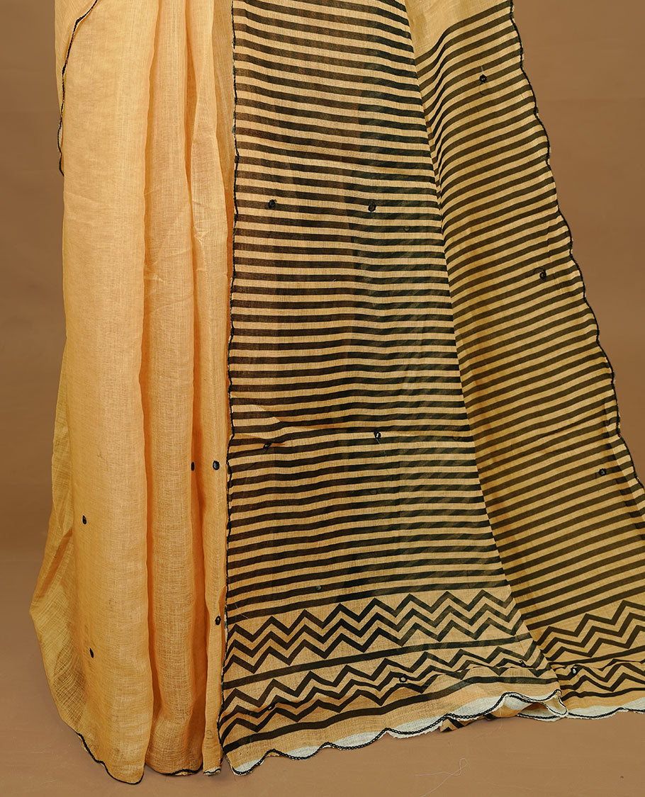Beige colour Semi Linen saree featuring mirror work with intricate thread detailing, enhanced by a stylish scallop border. Comes without a blouse piece.