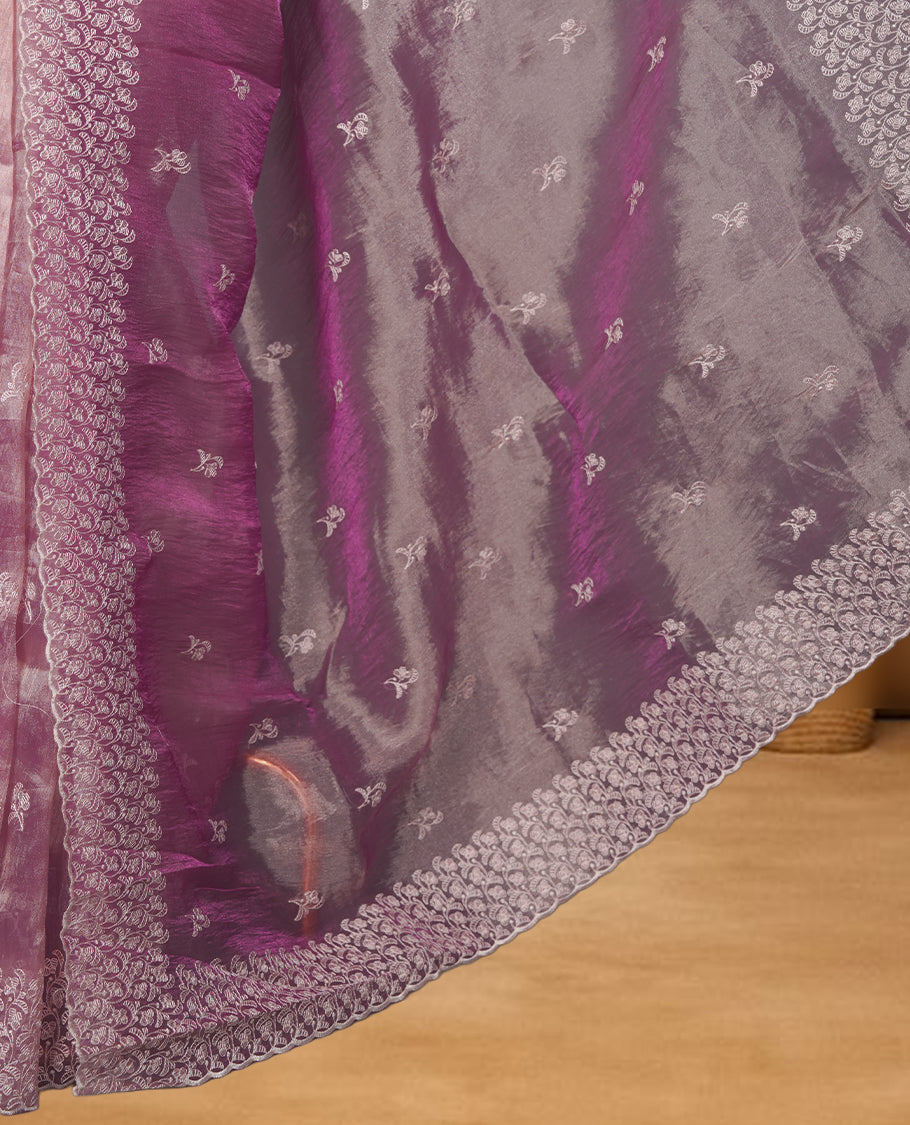 Pastel Mulberry colour net organza saree featuring white thread embroidery motifs on body and  thread detailing on the border and paired matching blouse.