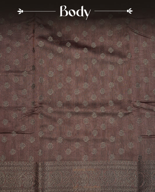 Copper brown colour semi tussar silk saree featuring elegant Antique zari motifs across the body, designed with a subtle borderless zari finish for a sophisticated traditional look. Paired with a matching blouse piece.