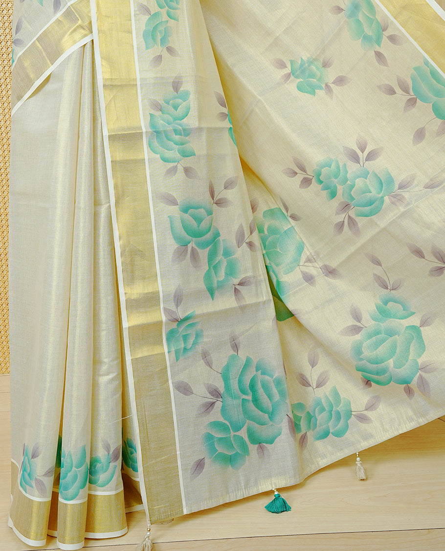 Cream Colour Tissue Kerala Saree Featuring Digital  Mind Rose Prints Across The Body, Enhanced With A Gold Zari Border , Finished With Mind & Cream Tassels And A Matching Blouse Piece