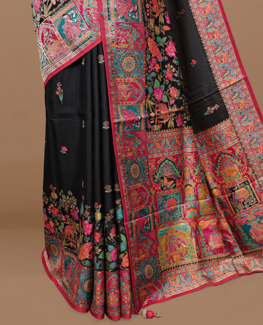 Black Pashmina silk saree featuring floral Pattern body, complemented by red border with multi colour bird motifs, complete with matching blouse piece.