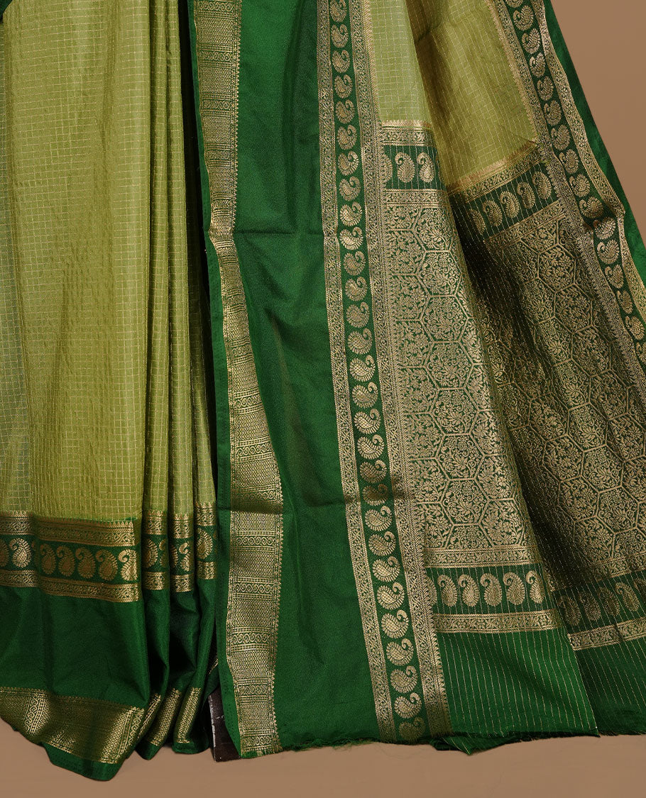 Pista colour semi georgette saree featuring gold zari check pattern on body, complemented by contrast green colour with zari border, paired with matching blouse piece.