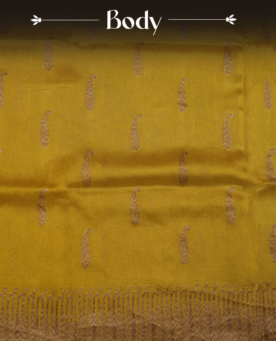 Yellow colour semi banaras tussar georgette featuring gold zari leaf pattern across body, finished with gold zari border and paired with matching blouse.