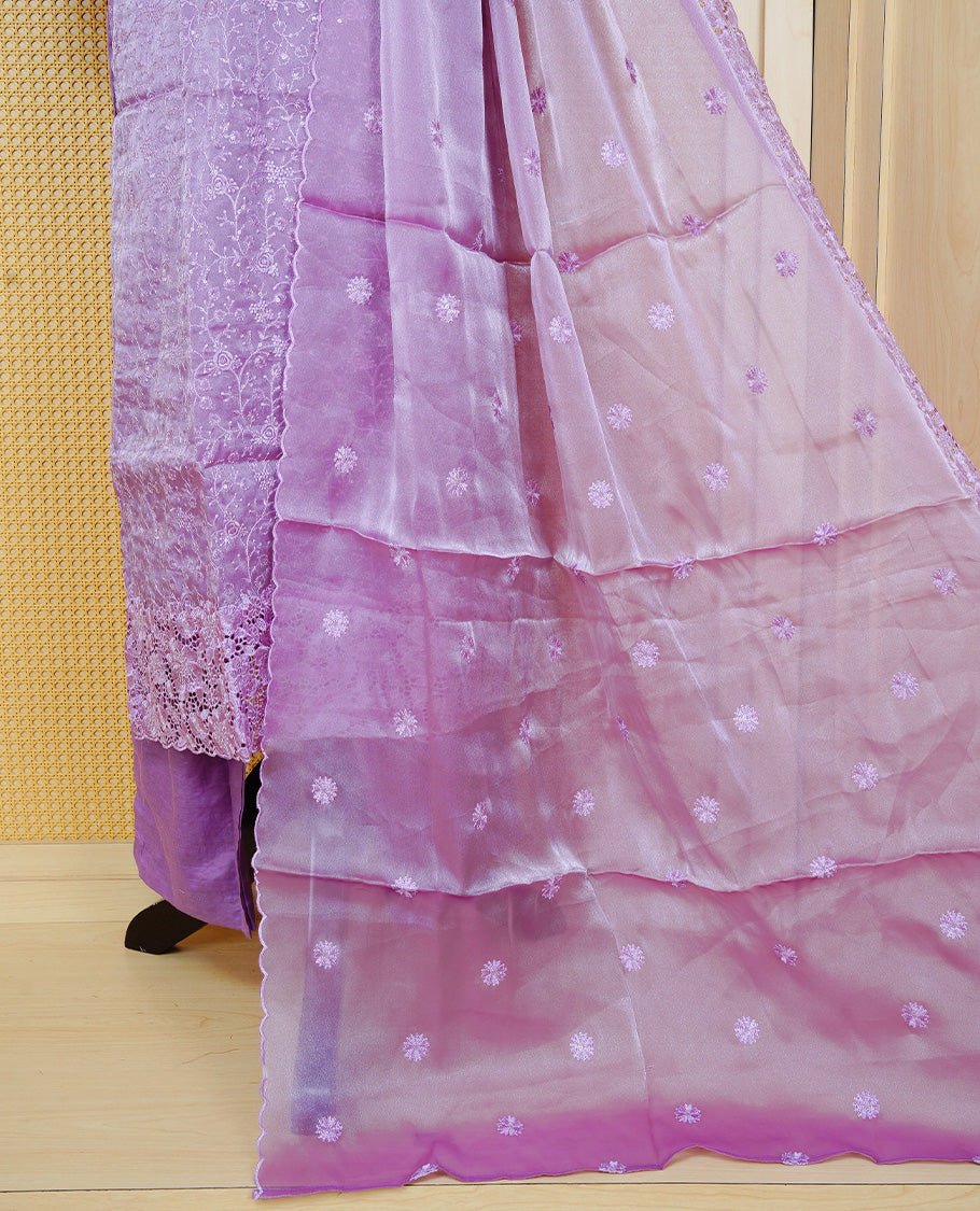 Lavender colour churidar set with floral thread embroidery on body & round neckline, paired with a matching embroidered dupatta and solid pants.