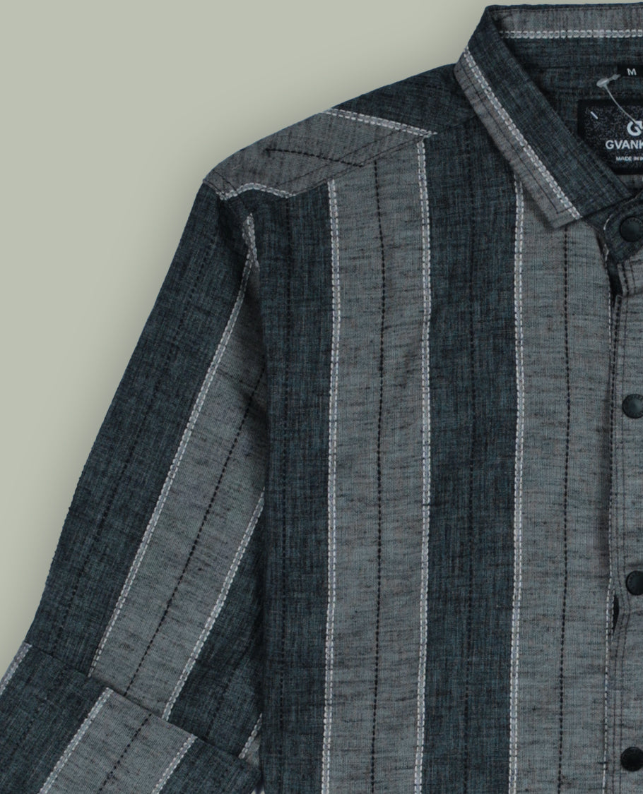 Grey colour striped shirt featuring a smart classic collar and comfortable full sleeves, Crafted in a soft fabric with a front button placket and minimal chest text print, giving a casual yet stylish appeal.