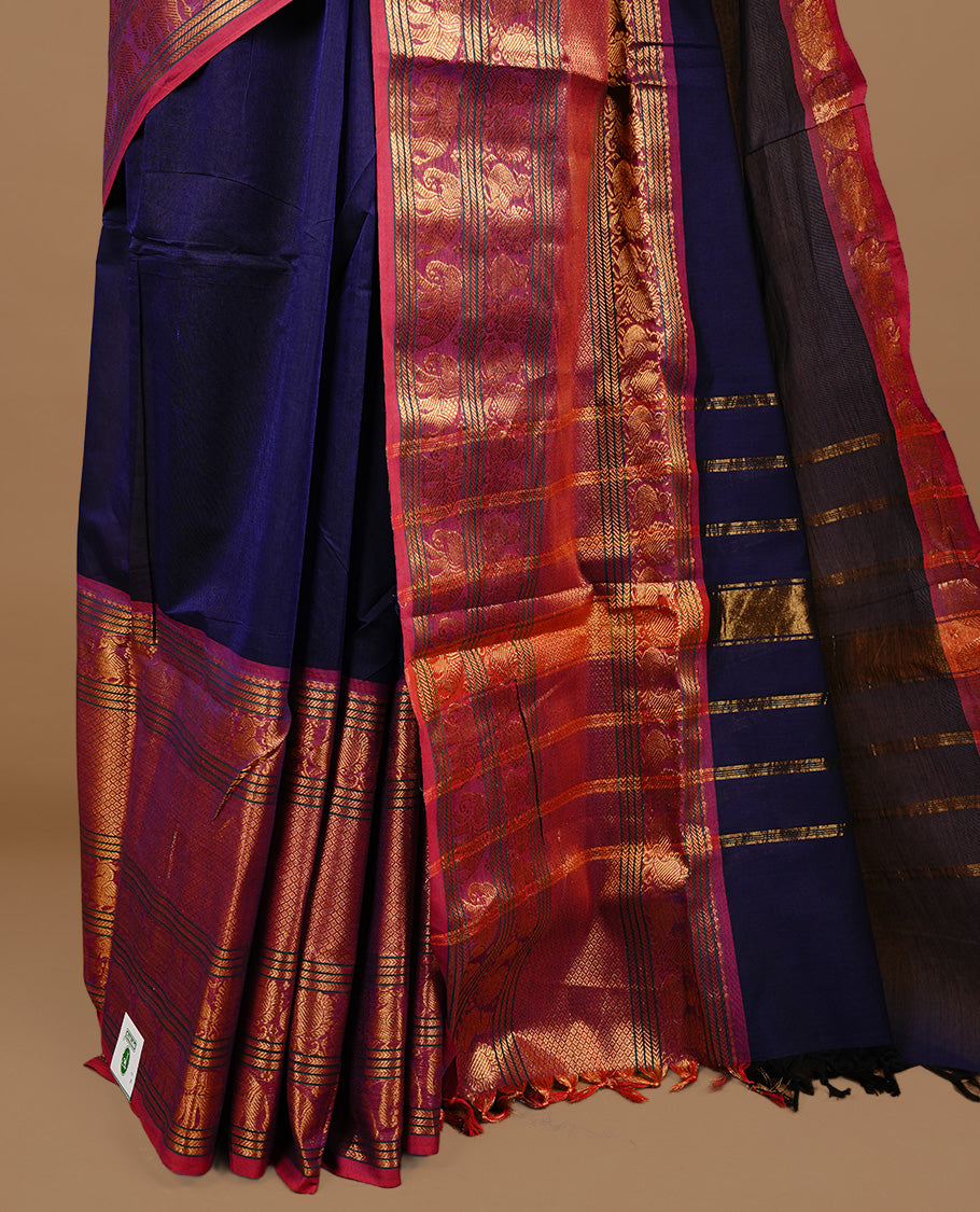 Navy blue colour chettinad cotton saree featuring Elegant plain body, complemented by magenta colour with traditional border, paired with matching blouse piece.