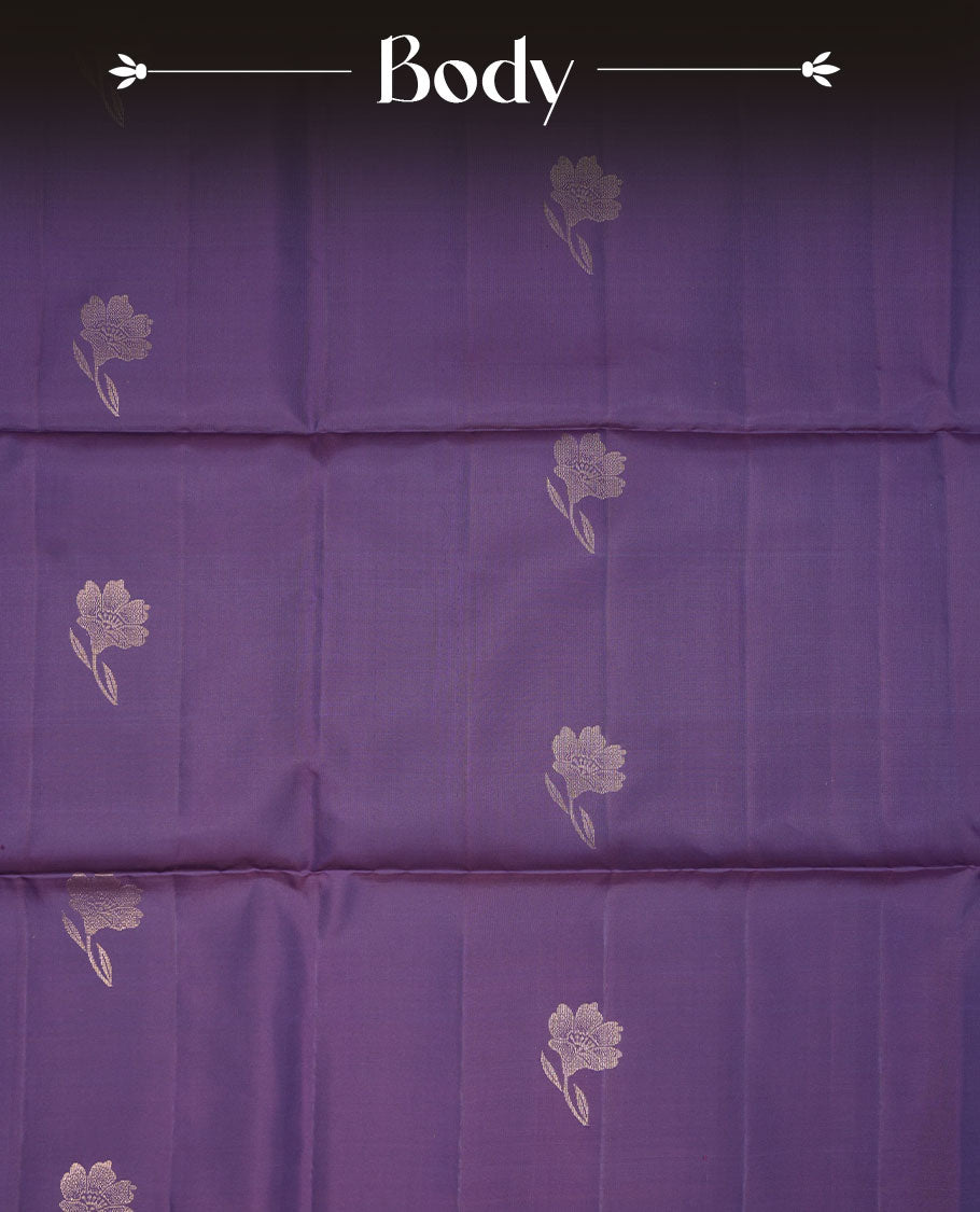 Indigo colour soft silk saree featuring gold zari motifs on body, complemented by self colour with traditional border with tassel at pallu, paired with matching blouse piece.