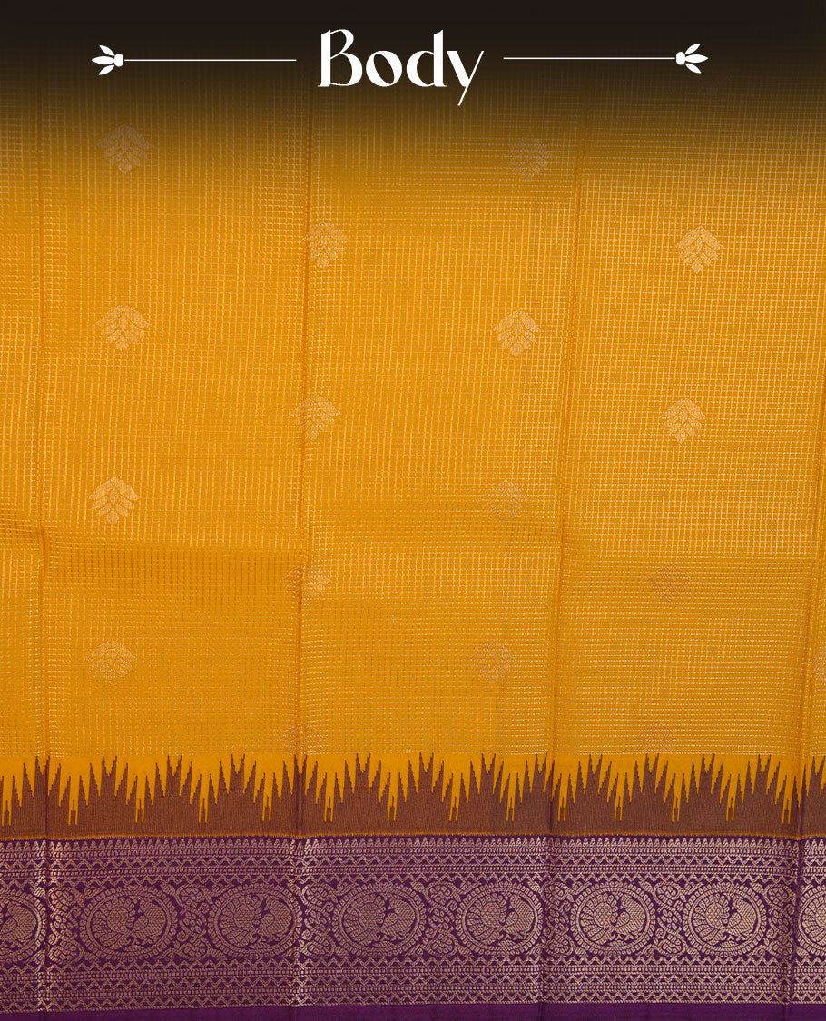 Mustard colour semi silk saree highlighting gold zari check pattern  and motifs across body, featuring contrast purple colour border with gold zari pattern, comes with matching blouse .