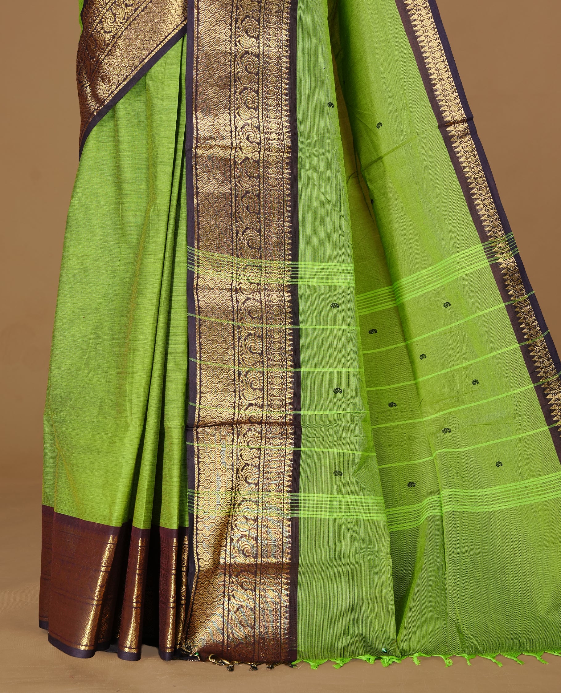 Green colour Chettinad cotton saree featuring motifs on body , complemented by contrast DarkBlue colour with zari border, comes with matching blouse piece.
