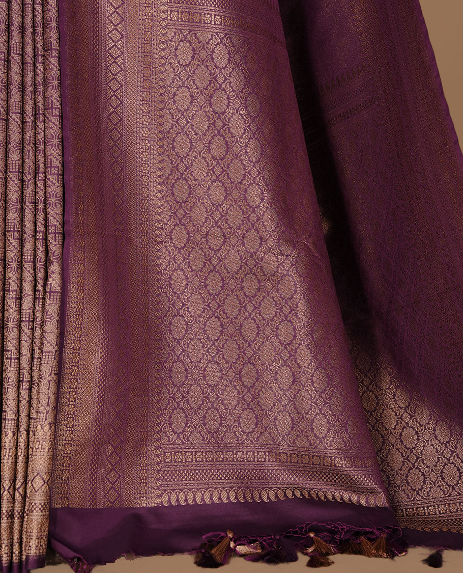 Purple colour semi banaras katan saree featuring Gold zari Pattern across body, complemented by self colour with zari border, paired with matching blouse piece.