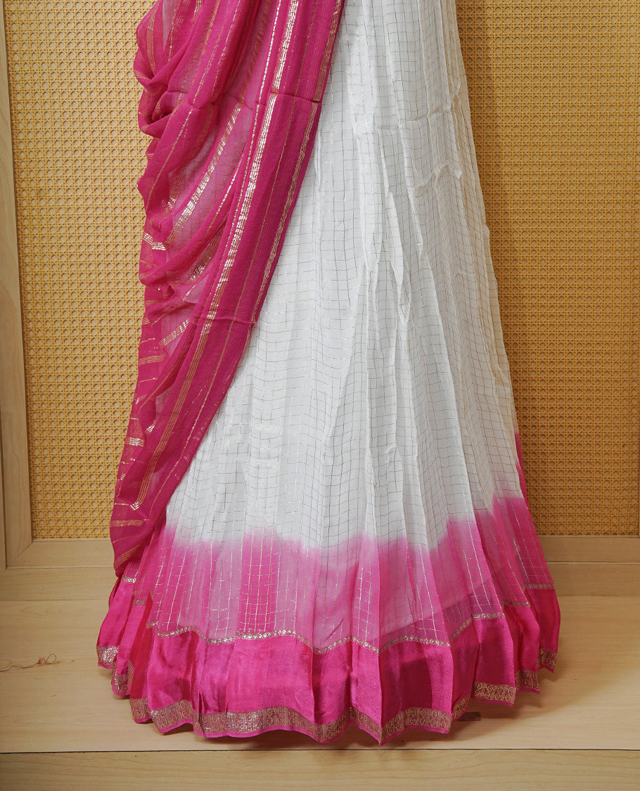 Off white colour Semi stitched dhavani set featuring Gold zari check pattern with contrast Magenta border skirt, paired with matching blouse & dupatta.