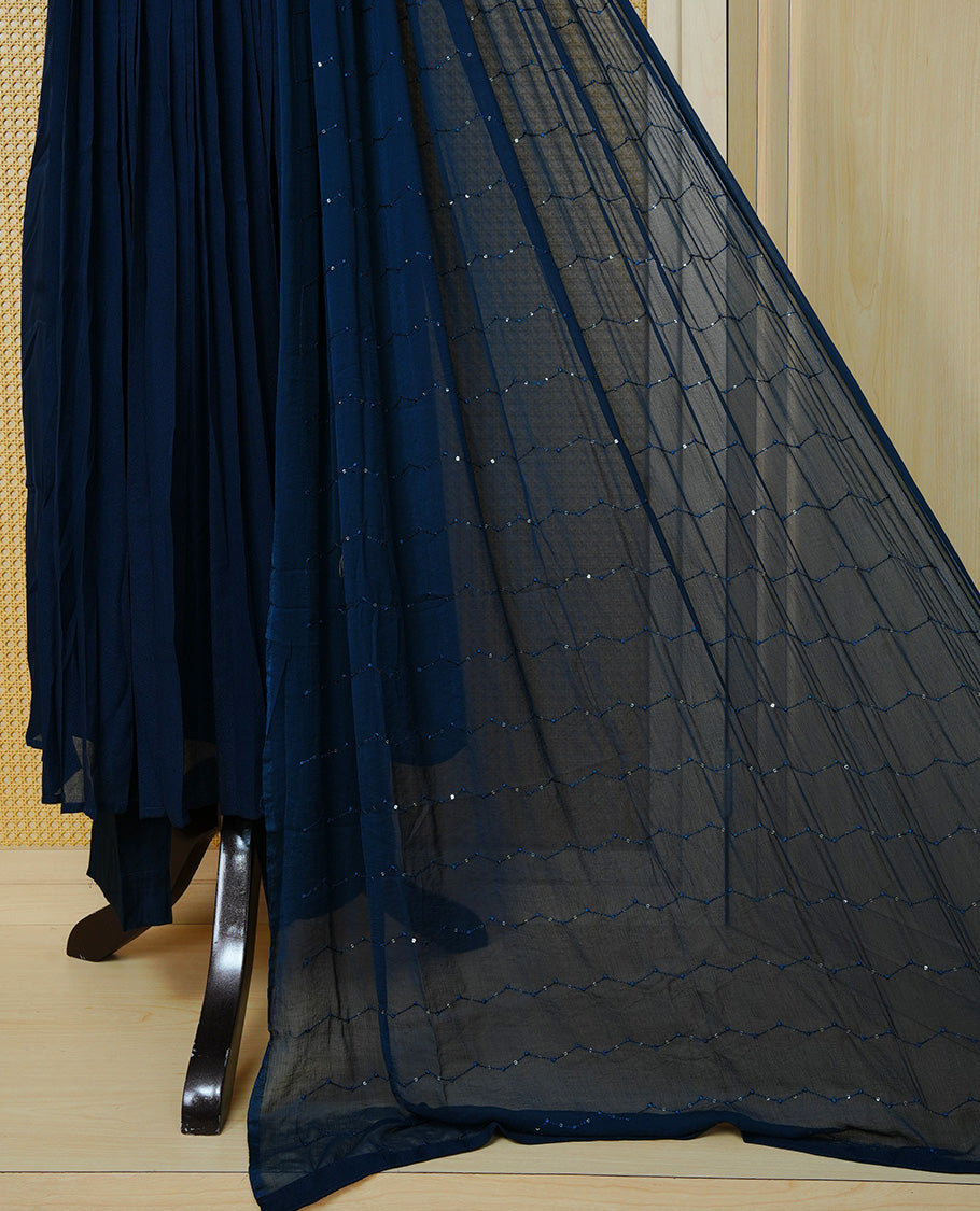 Navy blue churidar set with bead work on the V-neckline, paired with a matching embellished dupatta and solid pants.
