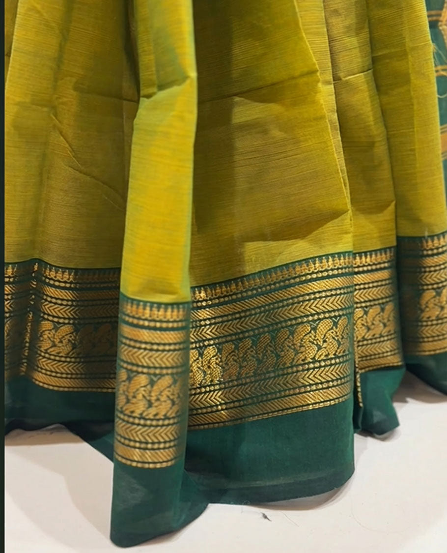 Lemon yellow with dark green dual tone colour chettinad cotton saree with traditional gold zari border without blouse piece.