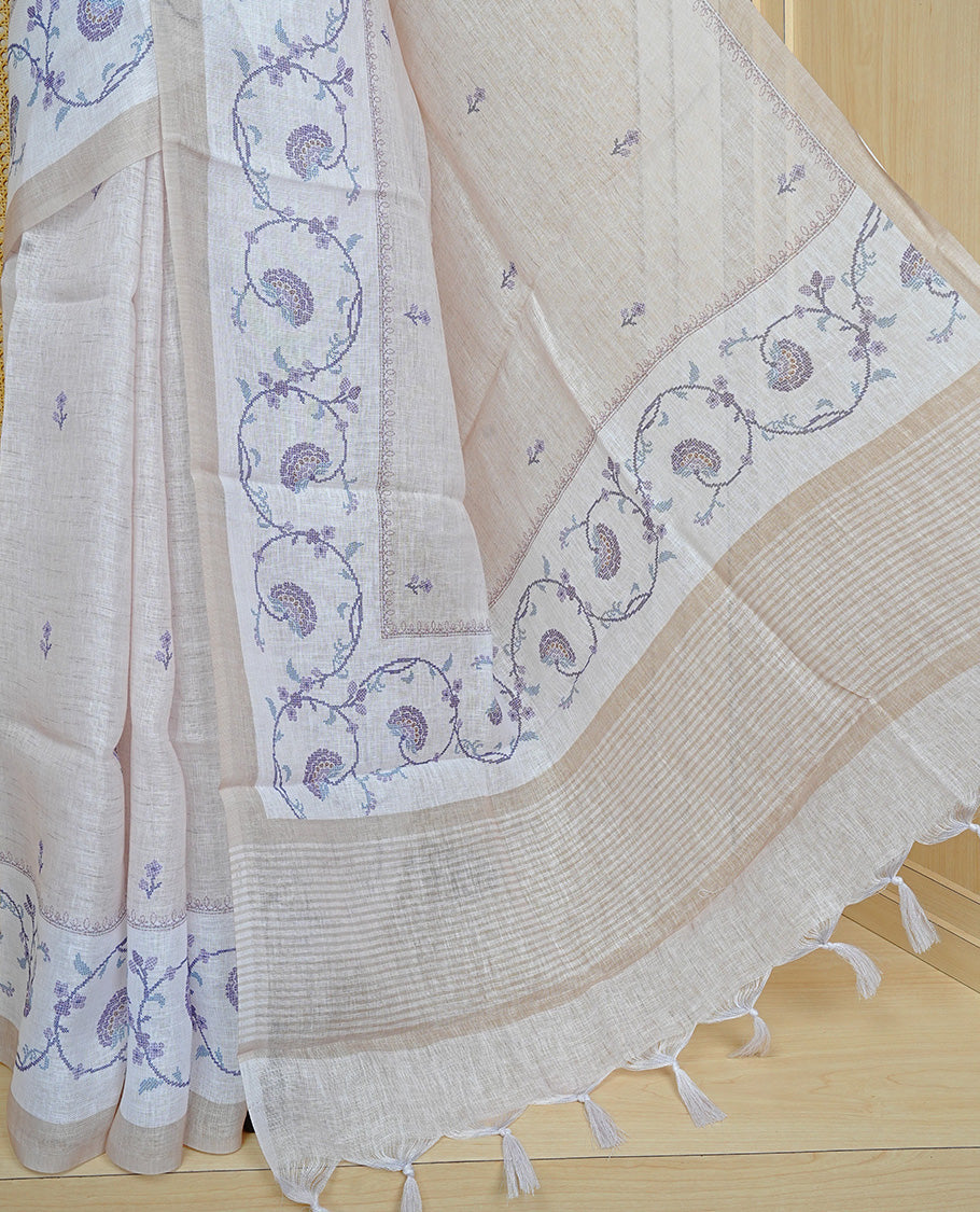 Beige colour semi linen saree featuring floral print on body, complemented by contrast Light gold colour with Design print border, comes with matching blouse piece.