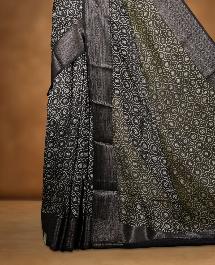 Olive colour chanderi silk saree with Floral block print On body, compilmented by  contrast dark green colour border with antique zari pattern and a matching blouse.