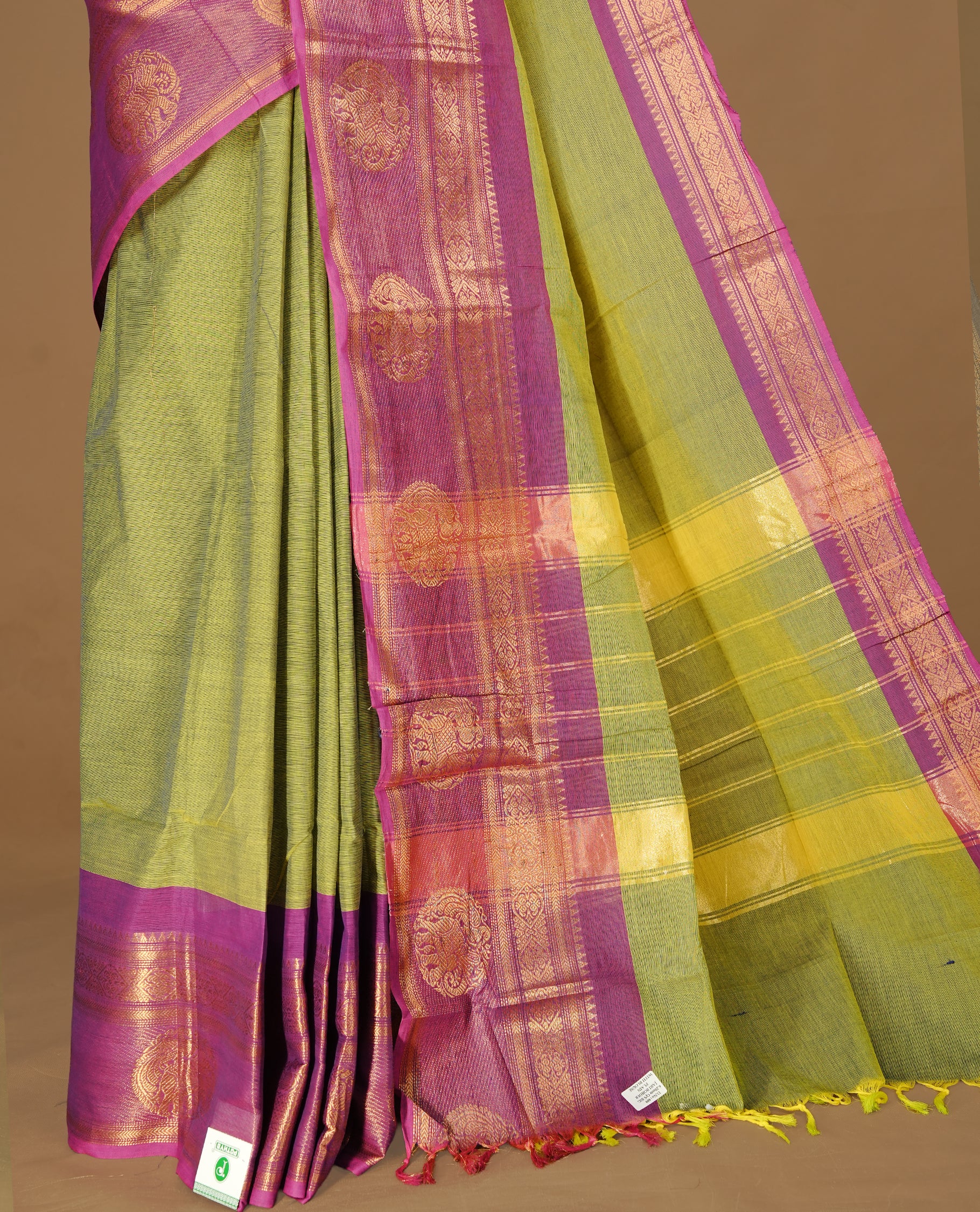 Olive Colour Chettinad cotton saree featuring elegant plain body , complemented by contrast Magenta colour with traditional border, comes with matching blouse piece.