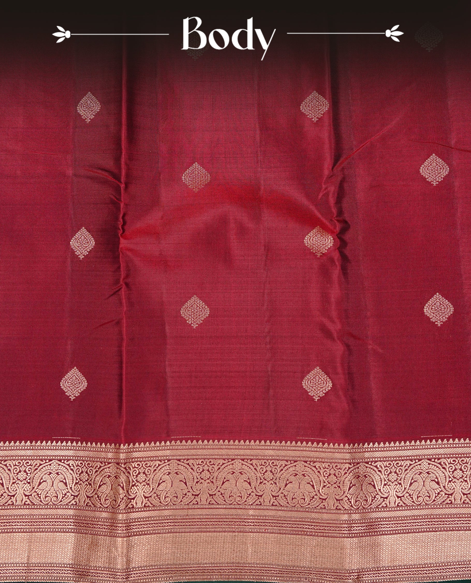 Maroon colour Kancheepuram Silk saree featuring Gold zari motifs on body, Enlighting Self Colour with Gold zari traditional & Green colour piping border, paired with a matching blouse piece.