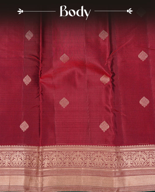 Maroon colour Kancheepuram Silk saree featuring Gold zari motifs on body, Enlighting Self Colour with Gold zari traditional & Green colour piping border, paired with a matching blouse piece.