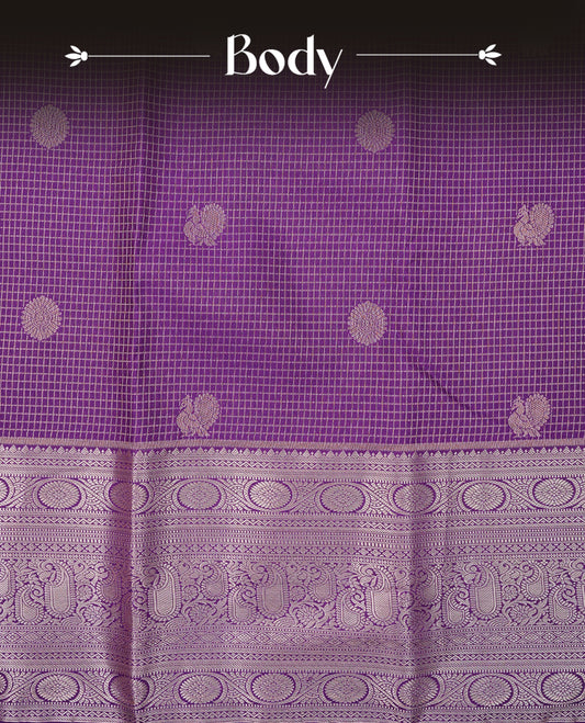 Deep purple colour semi wedding saree featuring gold zari check with peacocok motifs on body complemented by self colour with traditional border, comes with matching blouse piece.