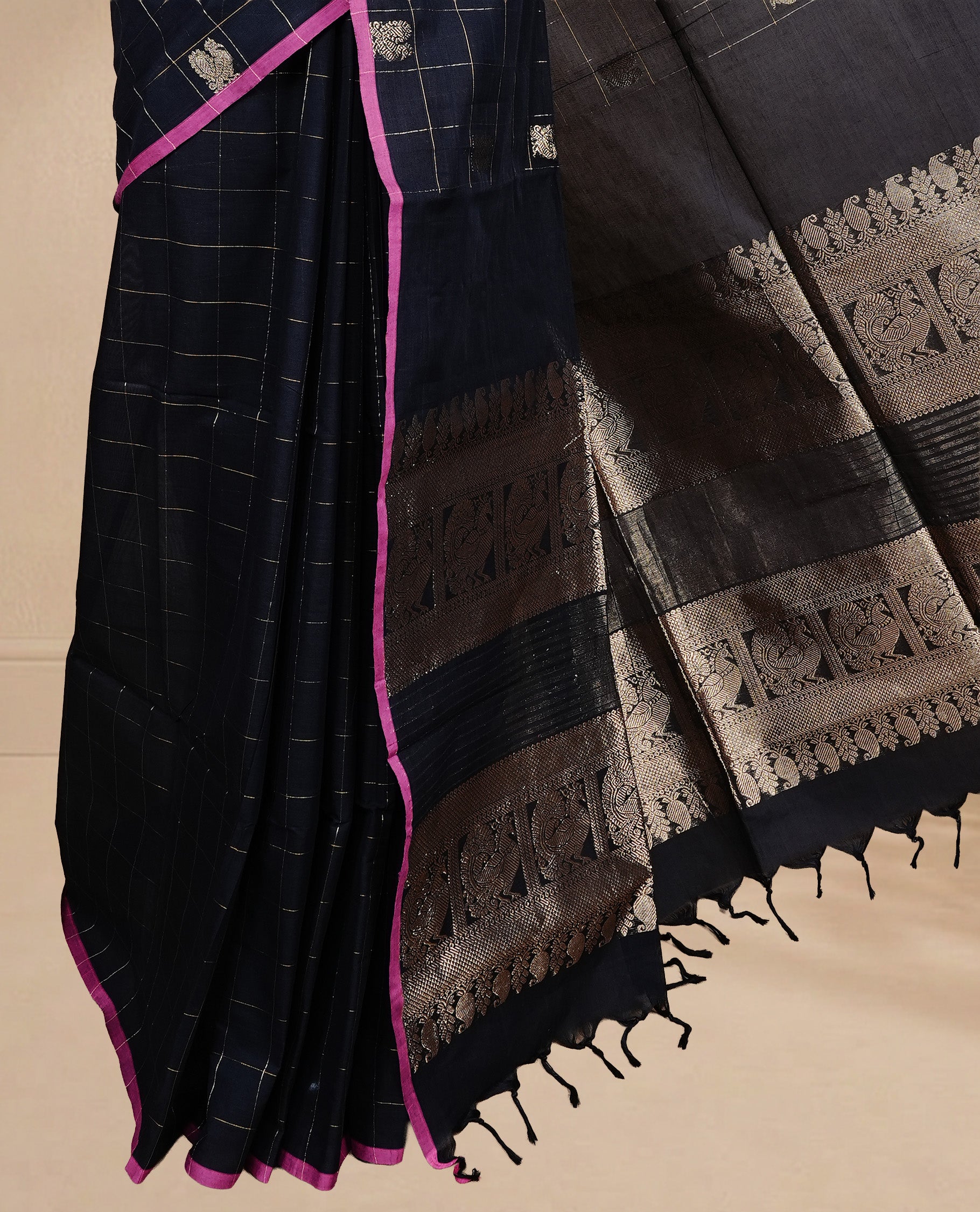 Black colour chettinad cotton saree featuring Gold zari check with Peacock motifs on body, complemented by Magenta colour piping border, paired with matching blouse.