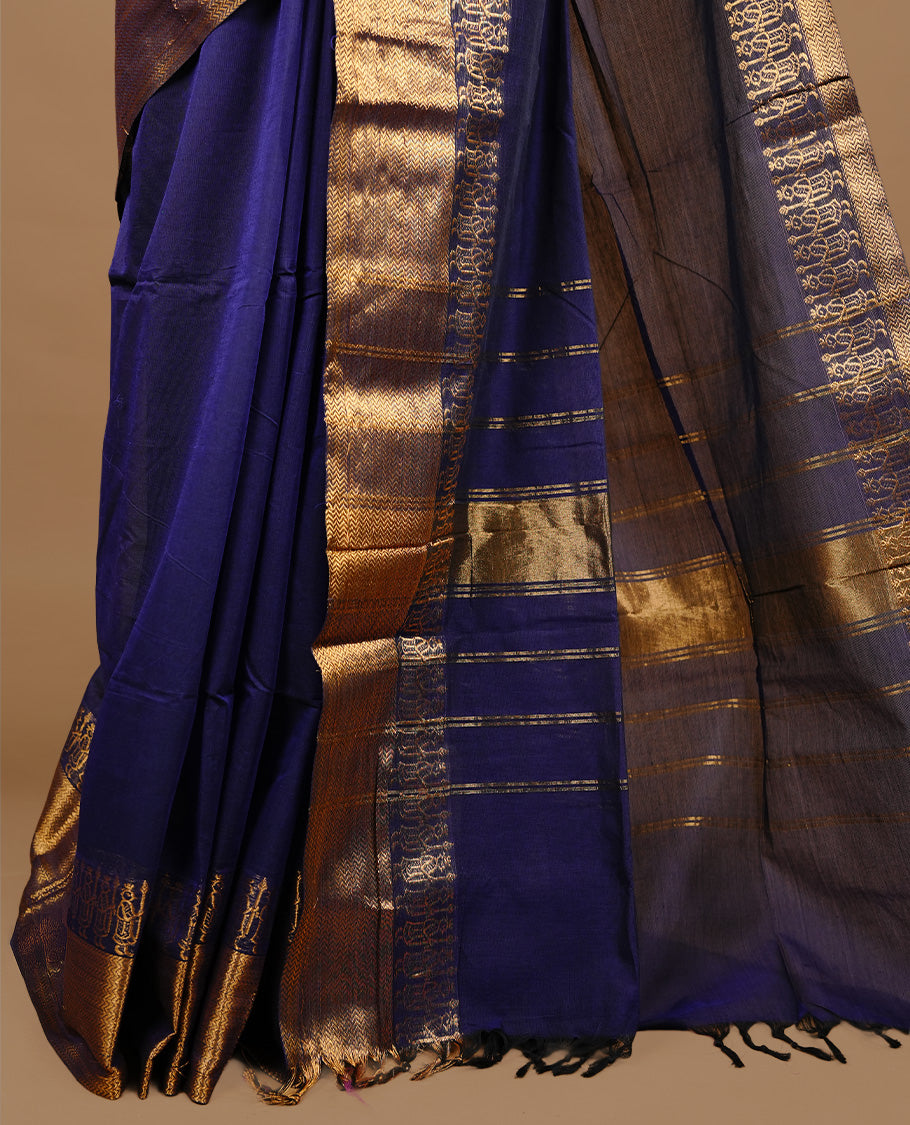 Navy blue colour chettinad cotton saree featuring elegant plain body, complemented by self colour with zari border, paired with matching blouse piece.