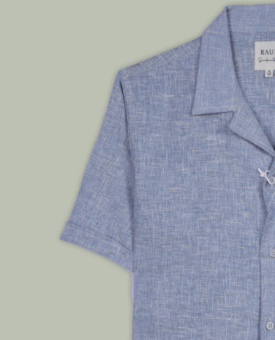 Pastel blue colour short sleeve shirt in a lightweight cotton linen blend, designed with a laid-back Cuban collar and chest pocket , it perfect for breezy, casual days.