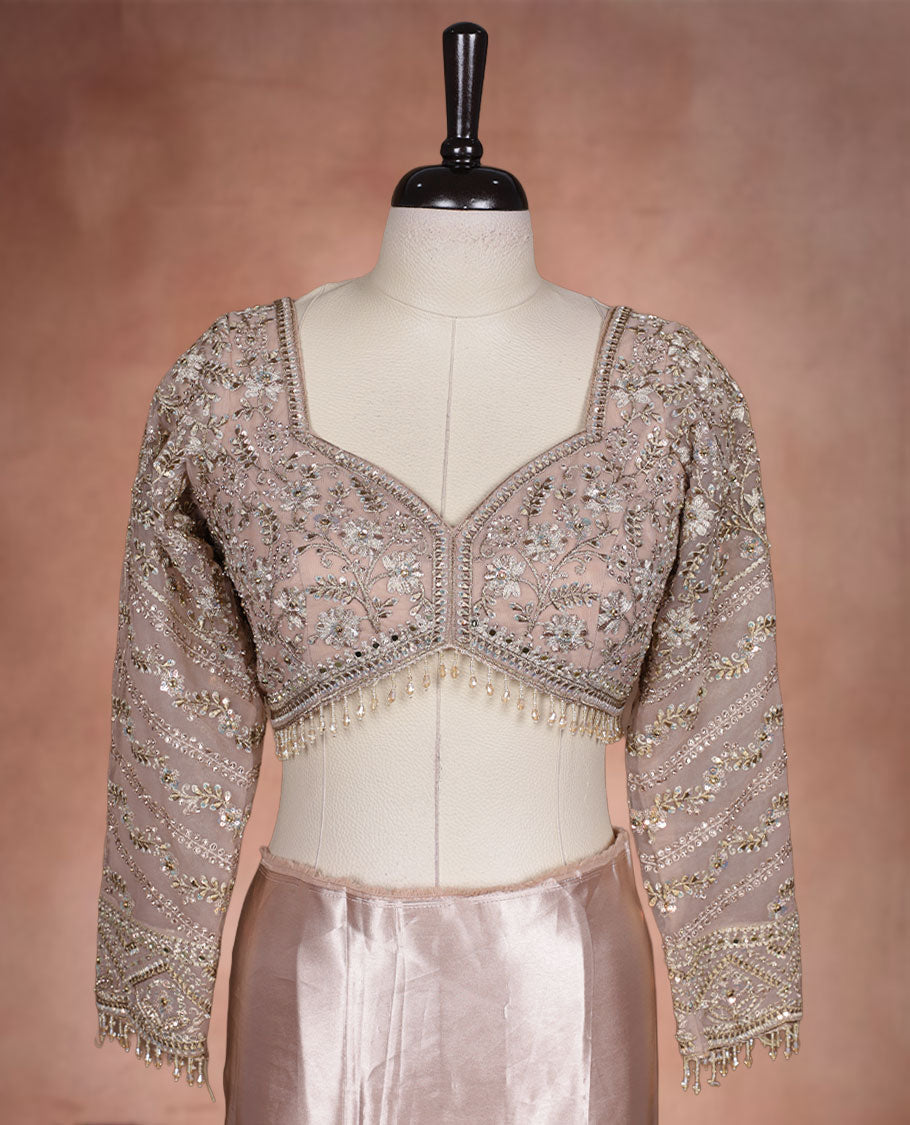 Beige Colour net designer Wedding saree featuring all over floral embroidery with sequin detailing and an ornate scalloped border, finished with a matching embellished blouse.