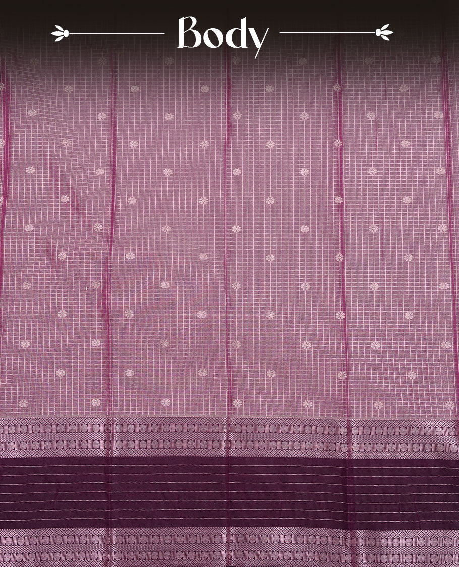 Lavender colour soft silk saree featuring rose Gold zari check & motifs on body, complemented by contrast purple colour with traditional border, paired with matching blouse piece.