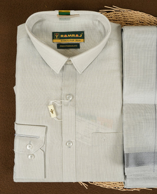 Blue Silver Colour shirt by RAMRAJ paired with a matching dhoti, all elegantly finished with a Blue silver border.